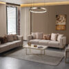 Luxurious beige living room with two matching sofas a glass coffee table and a circular pendant light in warm ambient lighting