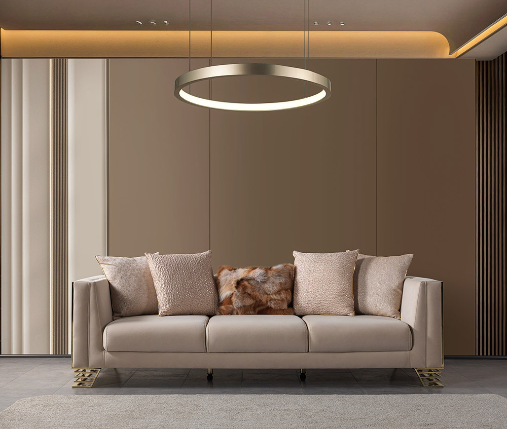 Anka Living Room 13 Armonna Modern beige sofa with neutral throw pillows in a warm luxurious living room featuring a circular ring pendant light overhead