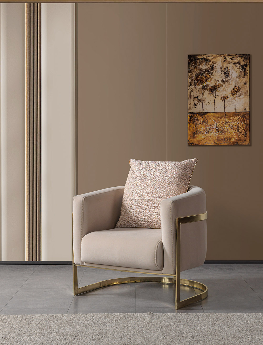Anka Living Room 14 Armonna Beige upholstered armchair with a gold metal frame and a textured pillow in a neutral living room with wall art
