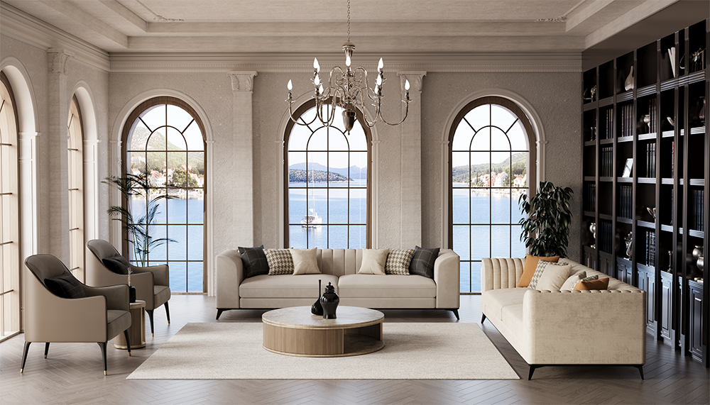 Elegant living room with arched windows overlooking a lake, a chandelier, and beige sofas arranged around a round coffee table with a neutral rug.