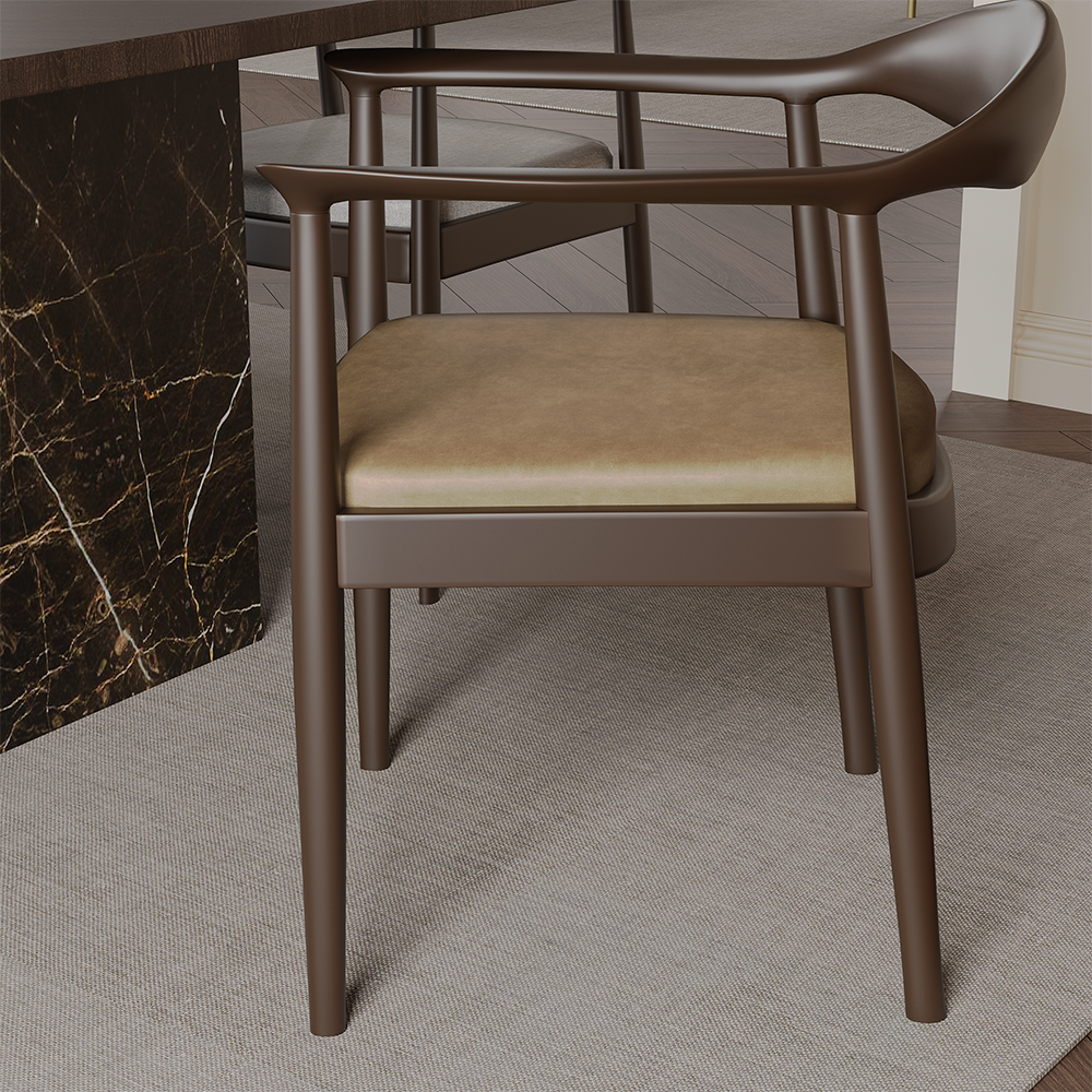 Brown modern armchair with a beige cushioned seat, positioned beside a dark marble desk on a beige rug