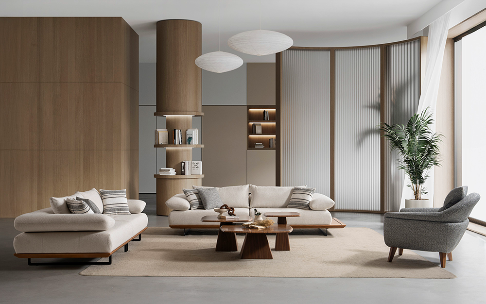 Modern living room with a beige sectional sofa, wooden coffee tables, and a grey armchair on a light rug.