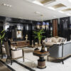 Luxurious hotel lobby with black glossy walls white marble floor and gold trimmed seating