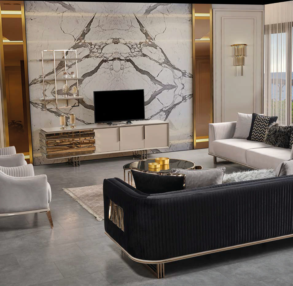 Luxurious living room with a marble feature wall a TV on a white console a black velvet sofa white armchairs and gold accents