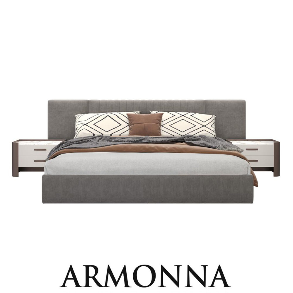 Grey upholstered platform bed with matching nightstands, geometric pillows, and brown throw in a modern bedroom setting; branded Armonna Furniture & Interiors at bottom.