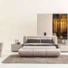 Modern bedroom with a plush gray upholstered bed matching nightstands and a large wardrobe in neutral tones