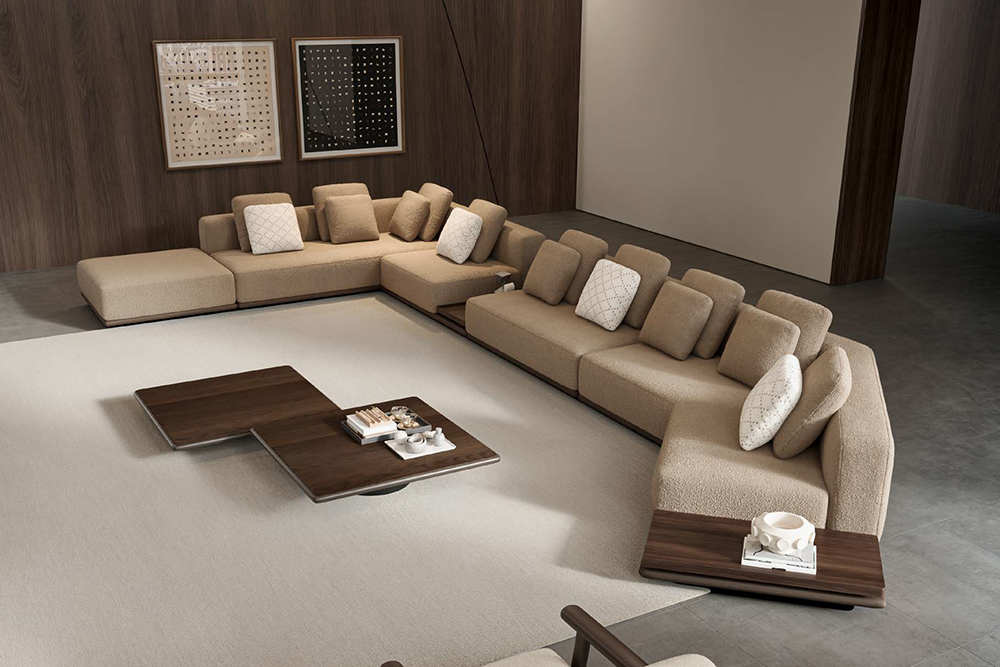 Cloud Corner Sofa 3 Armonna L shaped beige sectional sofa with multiple cushions in a modern lounge with wood paneled walls and abstract art on the wall