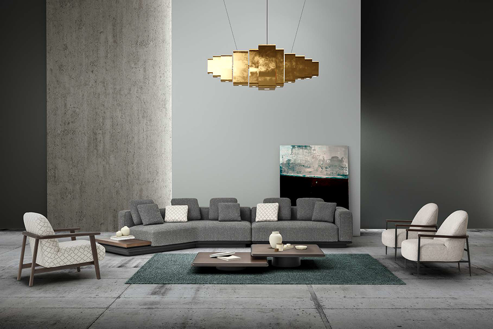 Cloud Corner Sofa 4 Armonna Modern living room with a gray sectional sofa white armchairs and a gold multi panel chandelier The room has a textured wall and a teal rug