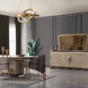 Diamond Living Room and TV Unit 13 Armonna Luxurious dining room with a round glass table six upholstered chairs and a gold accented sideboard with a mirrored top lighted by a sculptural chandelier