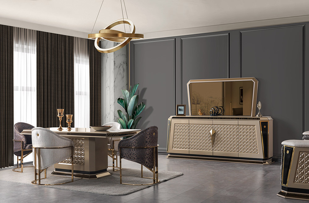 Luxurious dining room with a round glass table six upholstered chairs and a gold accented sideboard with a mirrored top lighted by a sculptural chandelier