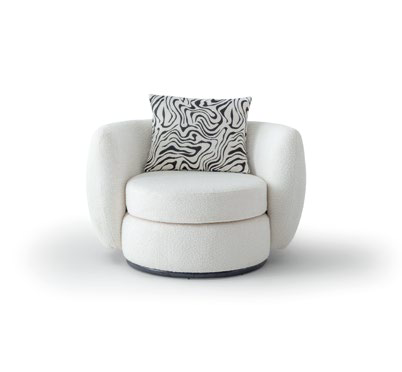 White circular lounge chair with rounded arms and a zebra-patterned pillow, resting on a soft shadowy surface