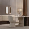 Modern beige and brown dining area with an oval table cream chairs and a matching sideboard in a stylish living room setting