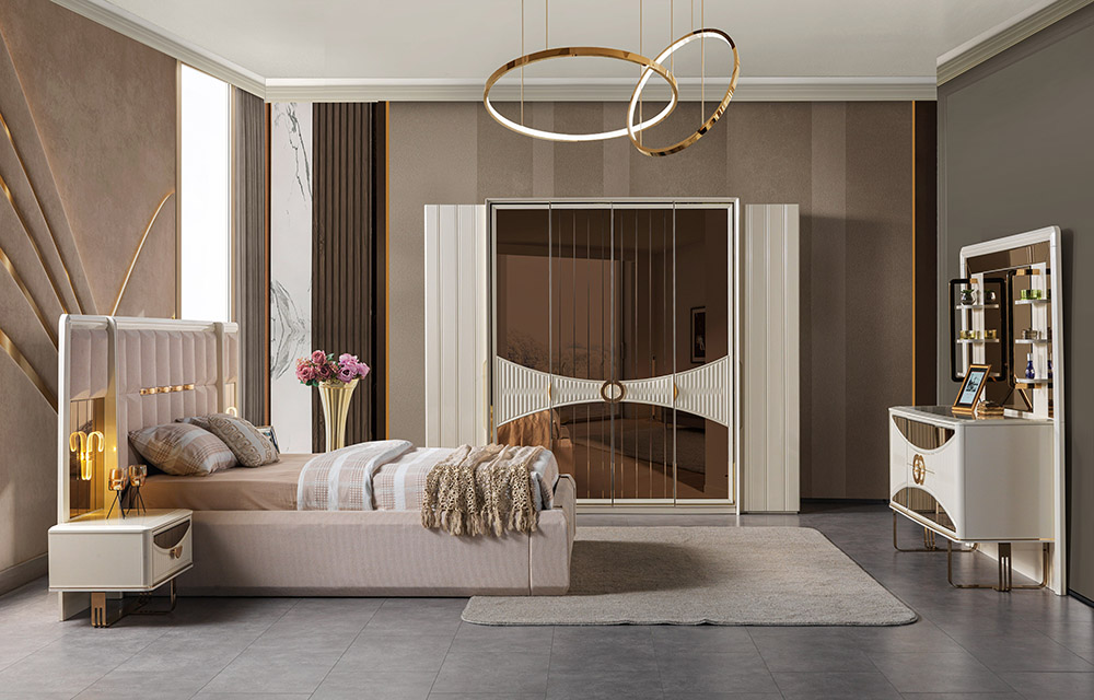 Luxurious modern bedroom with a beige upholstered bed, gold accents, and circular pendant lights overhead