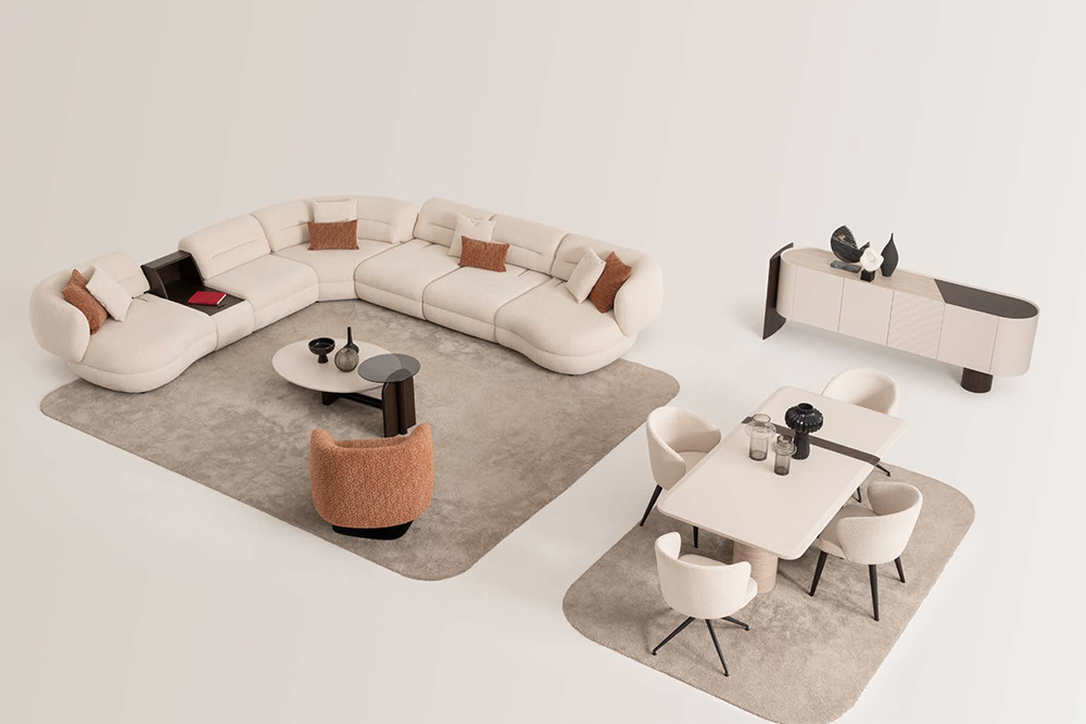 Open-concept living and dining space featuring a large curved cream sofa, beige rug, and a matching dining table with six chairs.