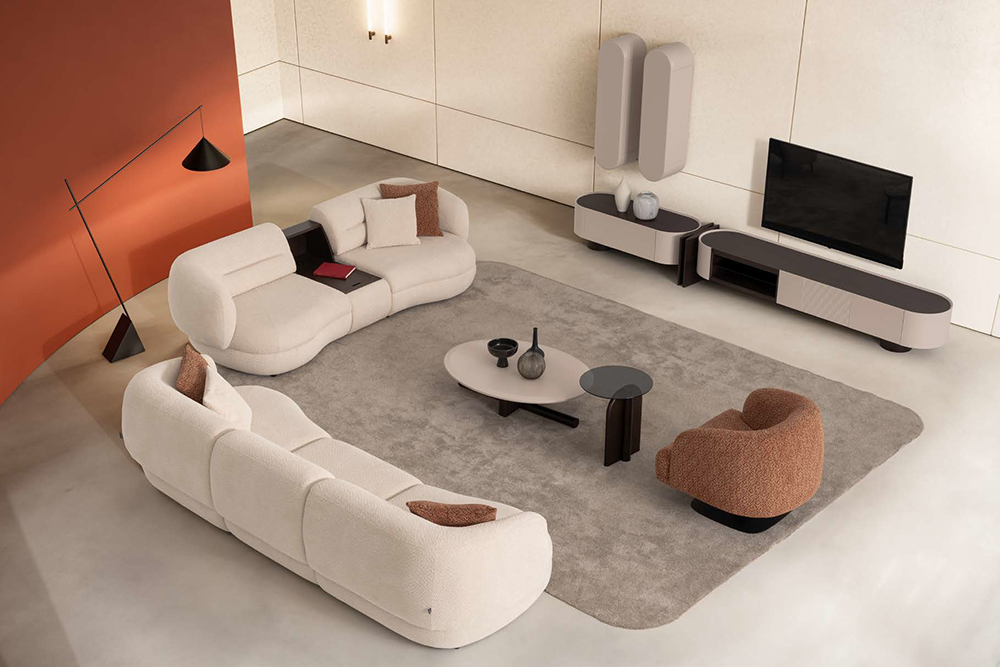 Fin Corner Set 4 Armonna Modern living room with offwhite curved sofa set a gray area rug and a low entertainment unit with a flat screen TV on the wall