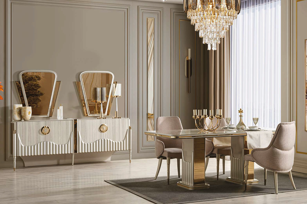 Luxurious dining room with a crystal chandelier, cream furniture, and a glass-top table with gold accents surrounded by upholstered chairs.