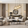 Luxurious living room with cream sofas and patterned cushions a round mirror above a black console and gold pendant lights over a glass coffee table