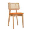Wooden chair with an orange fabric seat and a woven cane backrest