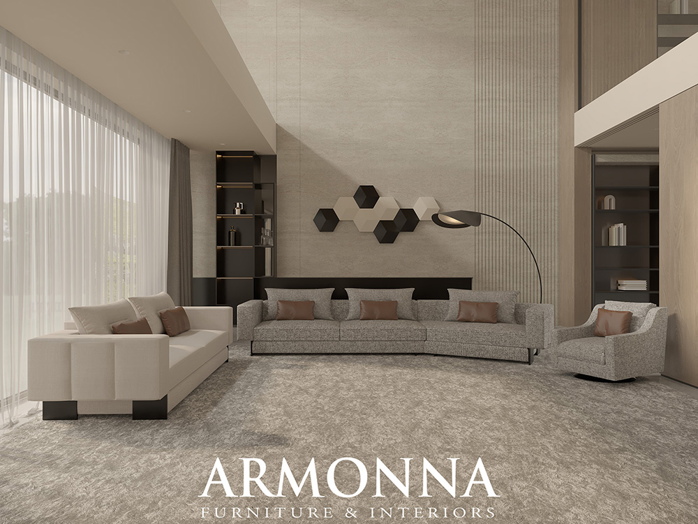 Contemporary showroom living room with three beige sofas, neutral decor, and geometric wall art; ARMONNA Furniture & Interiors logo at bottom.