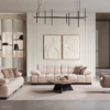 Modern living room with pale pink sectional sofas around a circular coffee table on a beige rug abstract art on the wall and a black geometric chandelier above