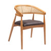 Wooden chair with a woven cane back and a black cushioned seat