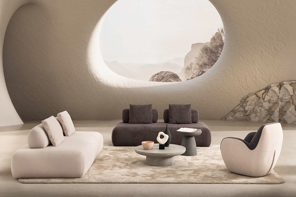 Modern living room with curved beige sofa, dark lounge, round coffee table, and a large oval window showing a rocky mountain landscape.