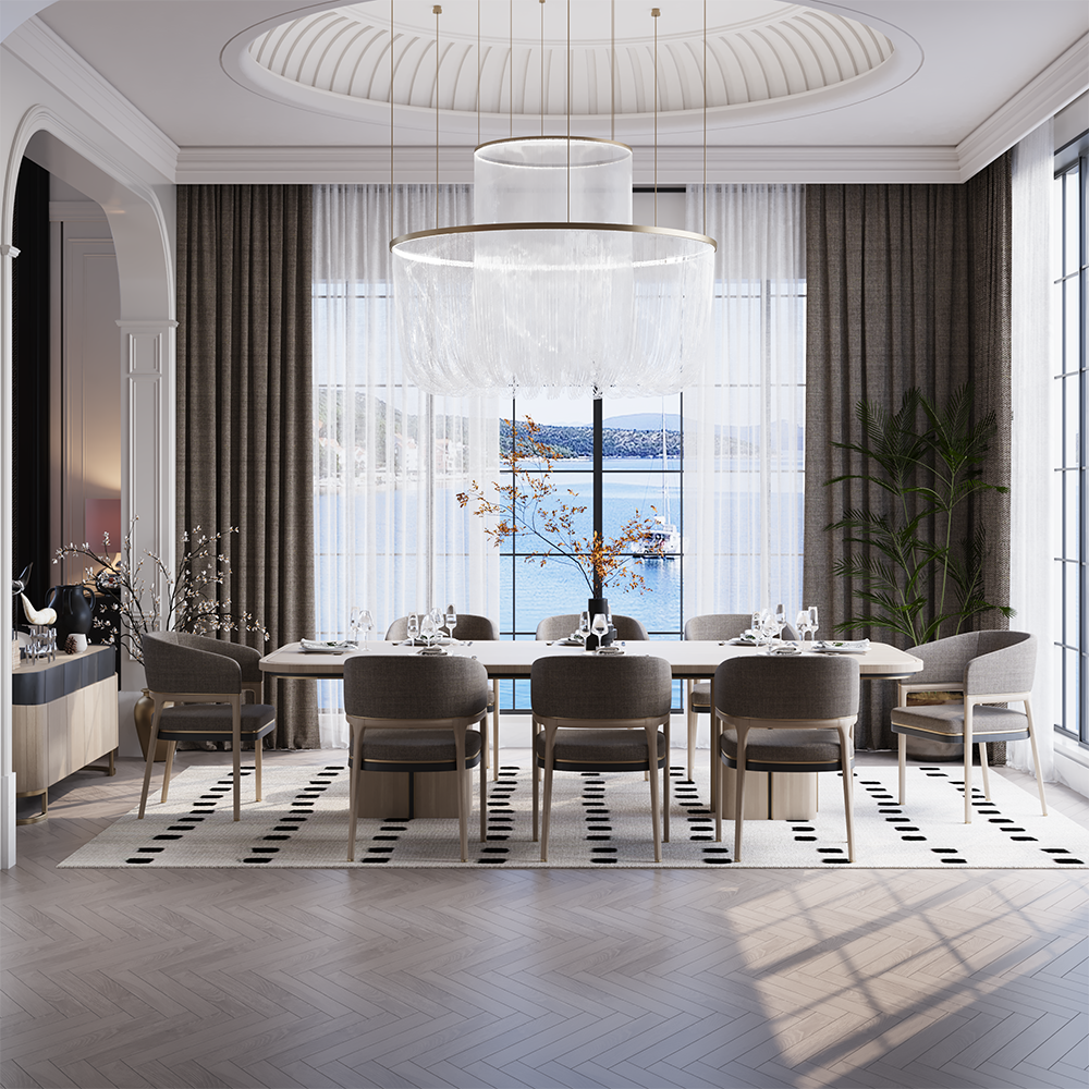 Elegant dining room overlooking a waterfront via large windows; a long white table with eight beige chairs and a modern chandelier.
