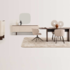 Modern dining room scene with a dark wood rectangular table surrounded by beige upholstered chairs on a light rug and a light sideboard with decorative objects against a pale wall