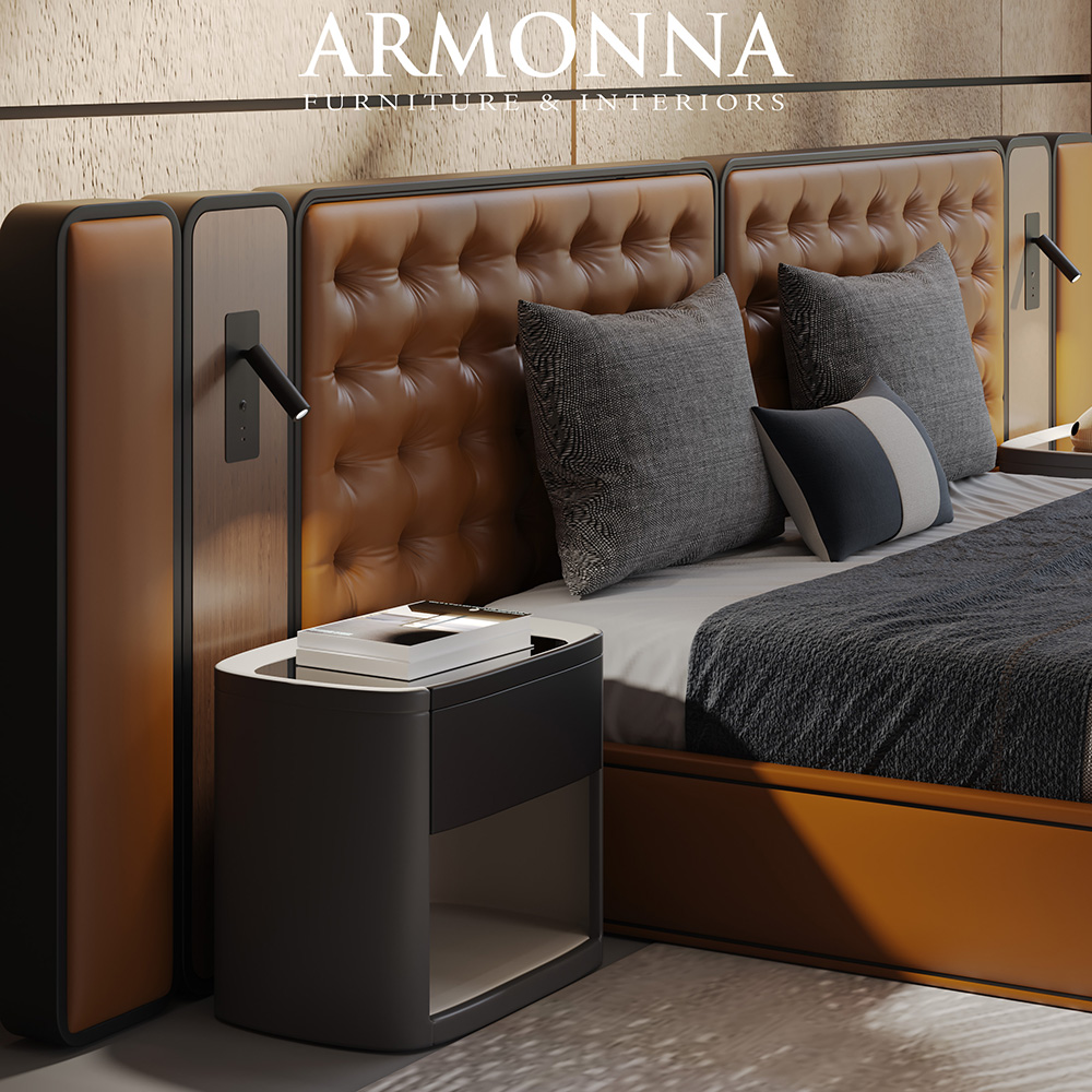Luxurious bedroom scene with a tufted brown leather headboard, dark nightstand, and decorative pillows by a neatly made bed.