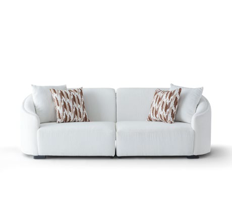 White two-seat sofa with two brown-and-white patterned throw pillows against a white background, minimalist living room style.