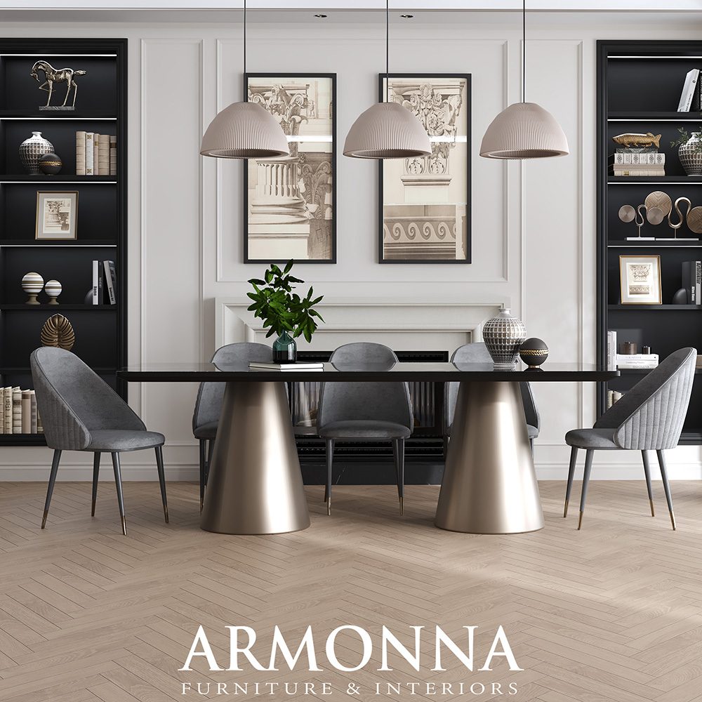 Modern dining room with a black glass table on gold cone bases, six gray upholstered chairs, and beige pendant lights above.