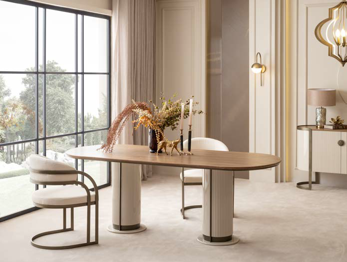 Elegant dining room with an oval wooden table, two upholstered chairs, and oversized windows letting in light.