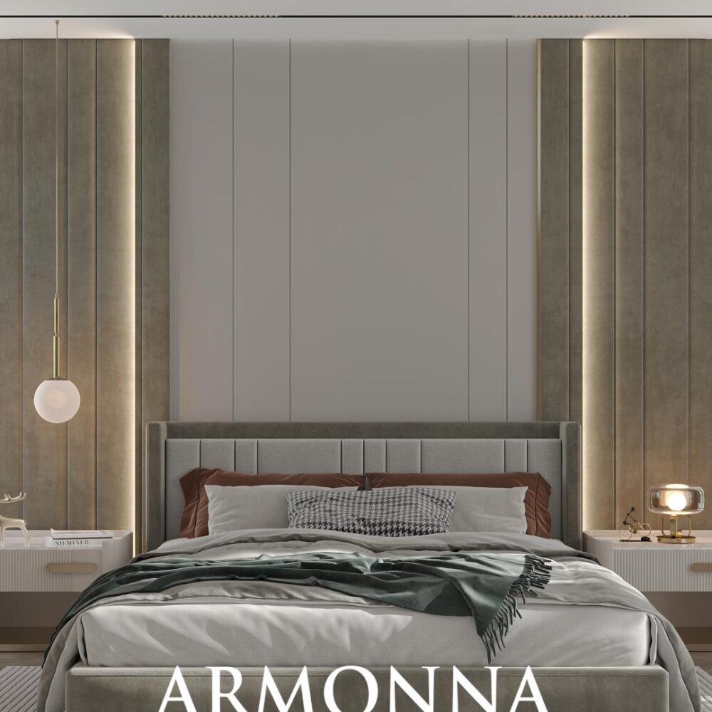 Luxurious modern bedroom with an upholstered gray bed, matching nightstands, warm pendant light, and neutral walls; Armonna Furniture & Interiors logo at the foot.