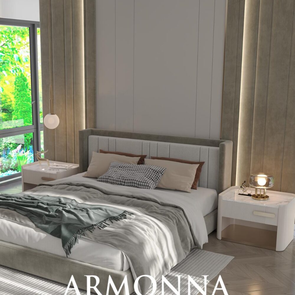 Modern bedroom with a tufted gray headboard, layered bedding, and white nightstands flanking the bed; large window with greenery outside enhancing natural light.