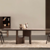 A modern wooden dining table with two matching chairs in a minimalist room beige rug and a shelf with ceramics in the background