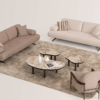 Living room with two beige sofas a cream armchair and four round marble topped coffee tables on a light rug