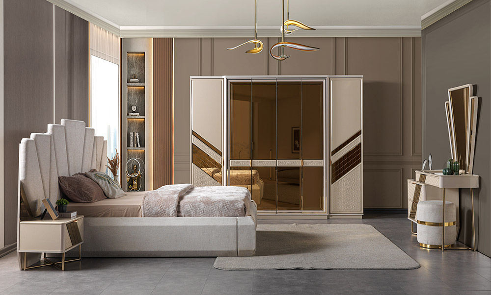Luxurious neutrally colored bedroom with a padded headboard, beige bedding, and a mirrored wardrobe at the center of the room.