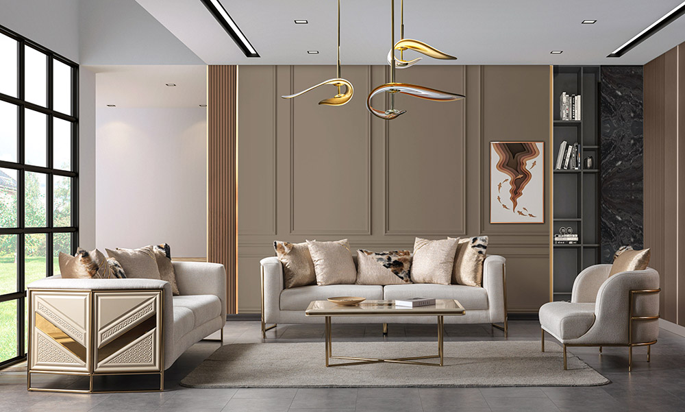 Modern living room with taupe walls two beige sofas gold accents and a glass top coffee table under a sculptural chandelier in a bright space