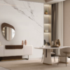 Modern living and dining area with a white and wood sideboard marble wall and a round mirror above