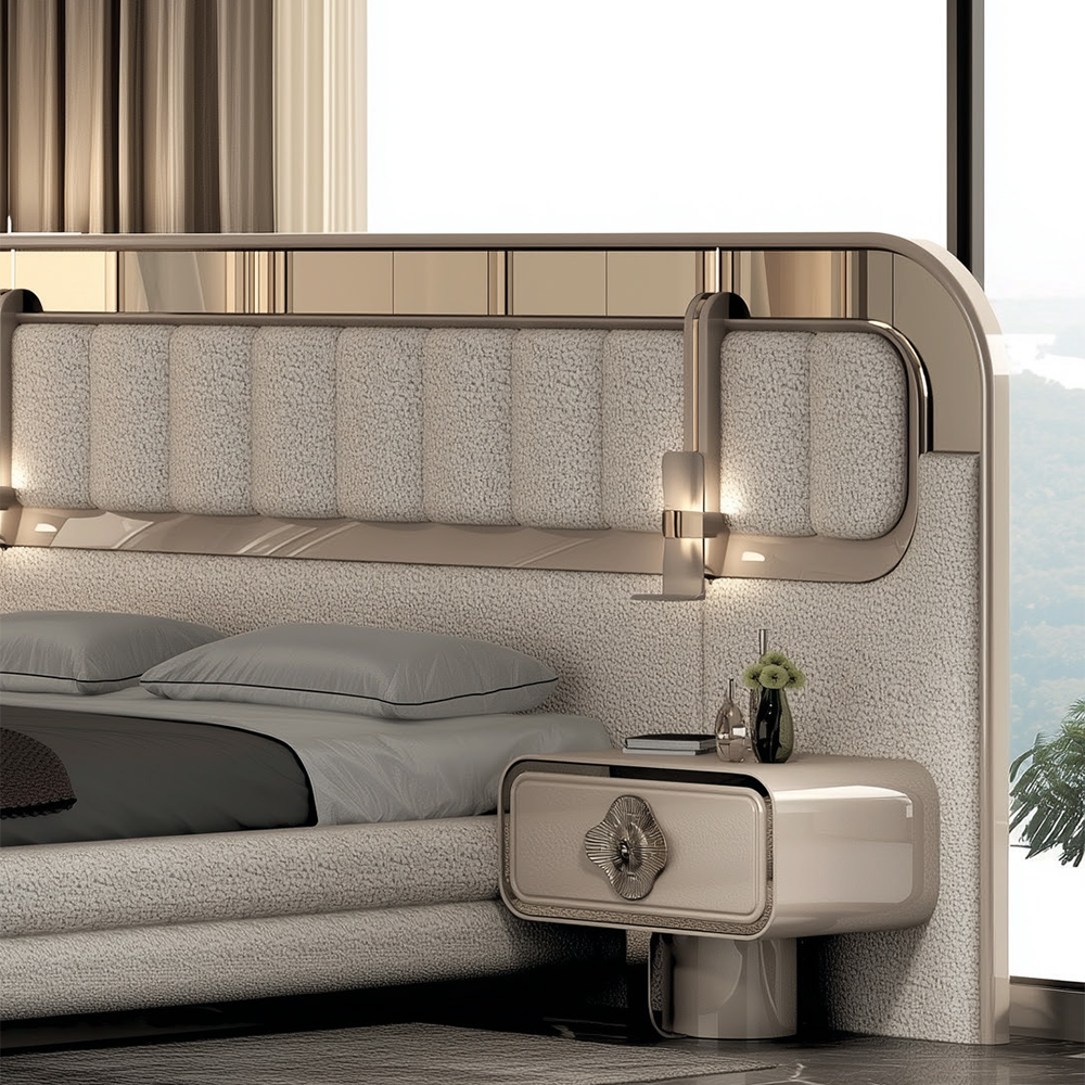 Luxurious beige bedroom with a curved upholstered headboard, matching nightstand, and a vase on the bedside table by a large window.