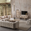 Luxurious living room with a tufted gray sectional matching chairs marble walls and a wall mounted TV on a beige console