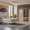Luxurious modern bedroom in a showroom upholstered bed matching nightstands gold accents and a large mirrored wardrobe