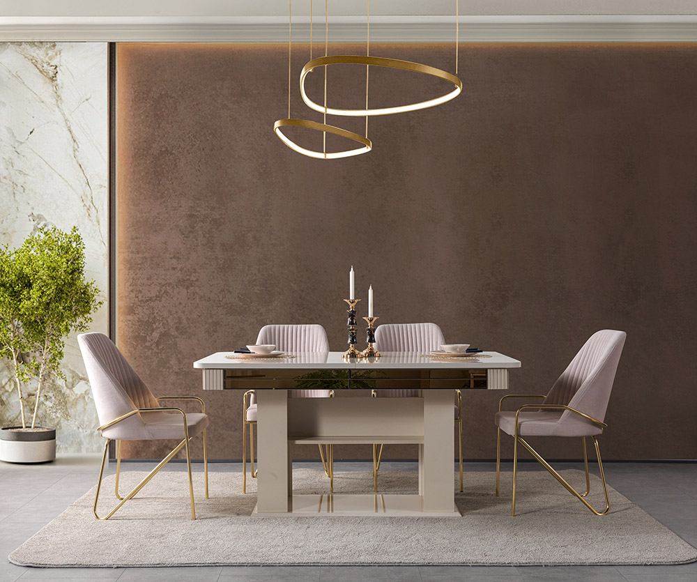 Nisan Dining Room and TV Unit 8 Armonna Elegant dining room with a cream table pale pink upholstered chairs and gold accents candles centerpiece on a beige rug