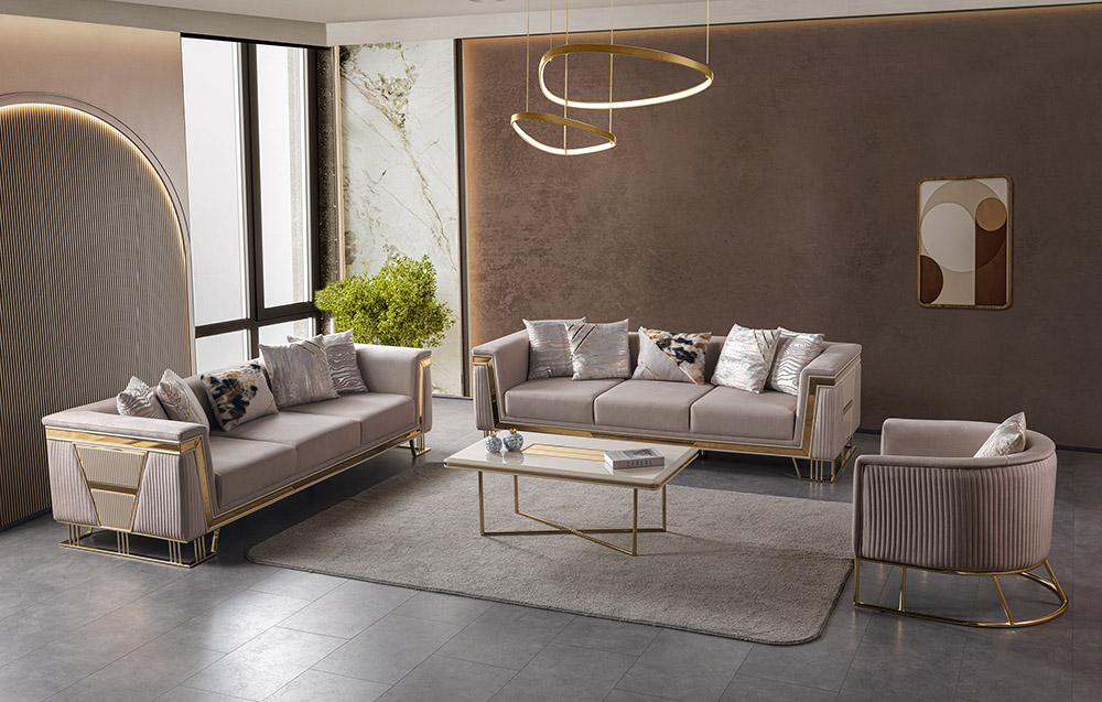 Luxurious modern living room with two beige velvet sofas a matching armchair gold metal frames and a glass coffee table in a sunlit space