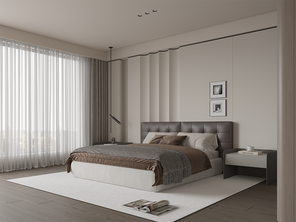 Modern hotel-style bedroom with a tufted grey headboard, brown bedding, and a white rug; large window with sheer curtains on the left; nightstand with a book and mug on the right.