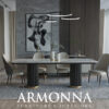 Modern dining room with a marble top table six beige upholstered chairs circular pendant lights and a gray textured rug