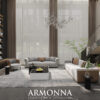 Luxurious living room with tall sheer curtains neutral sofas a marble coffee table and a sculptural chandelier