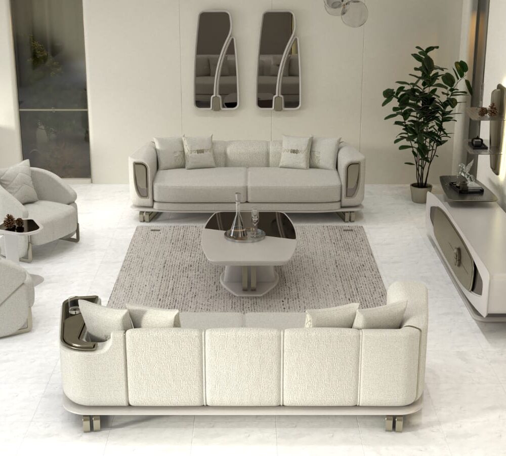 Modern white living room with a sectional sofa, two armchairs, a round coffee table, rug, TV stand, and a tall plant.