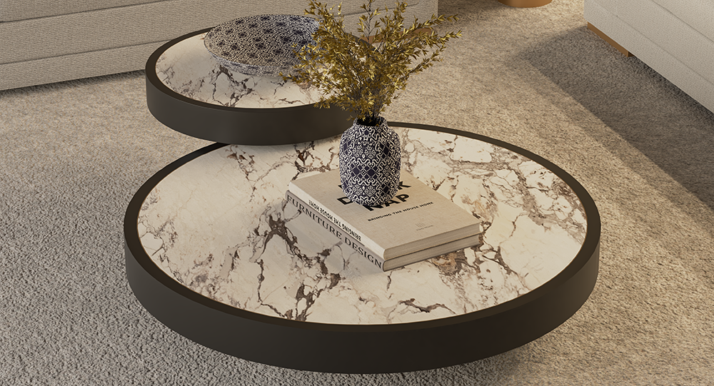 Round marble-topped coffee tables with a blue-and-white vase and dried plant centerpiece in a living room. A book rests on the lower table.