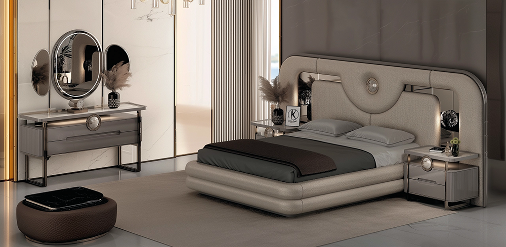 Luxurious modern bedroom with a rounded beige upholstered bed, matching nightstands, and a soft neutral palette.